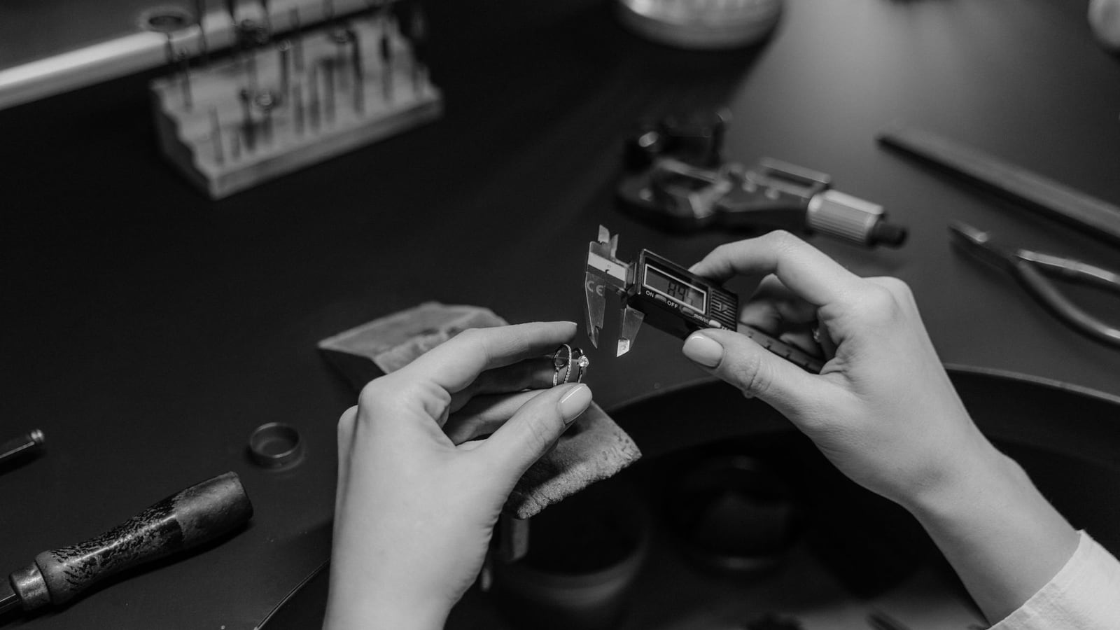 Using a digital caliper to verify the dimensional accuracy of a 3D printed prototype.