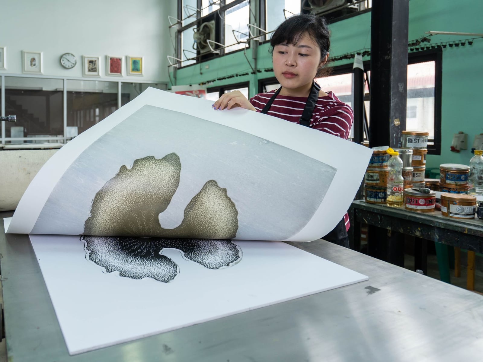 Technician meticulously sanding a 3D printed prototype for a smooth finish.
